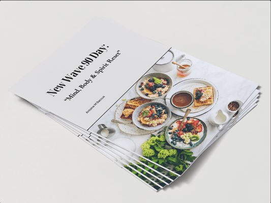 Stack of New Wave 90 Day: Mind, Body & Spirit Reset Transformation digital wellness program booklets featuring healthy meals on the cover. Ideal for Christian health, fitness, and spiritual growth.